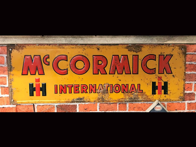 Original 1938 embossed tin McCormick International sign