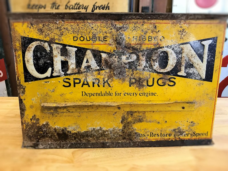 1940s embossed Champion spark plug counter display