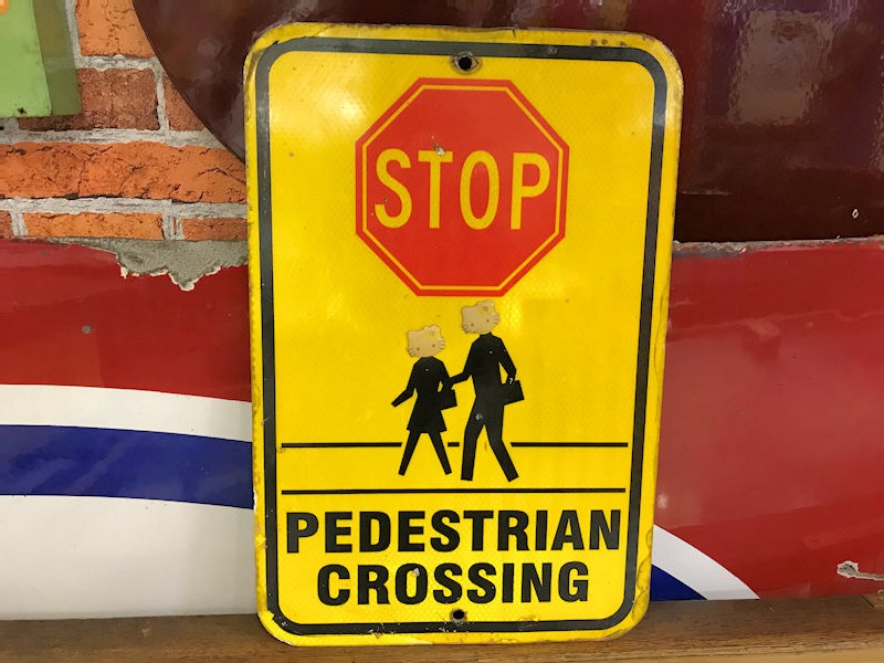 American cats eyes reflective Stop pedestrian crossing sign
