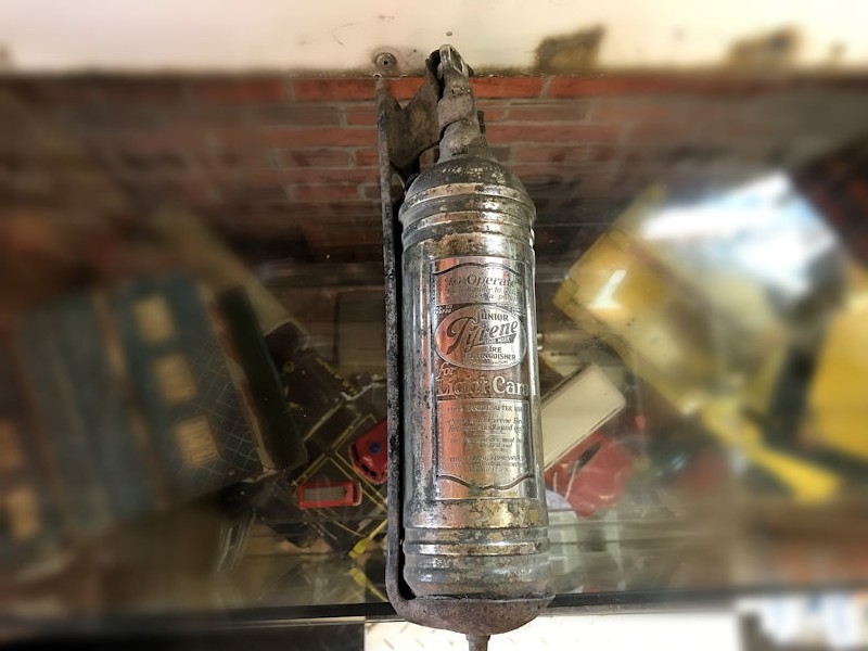 All original chrome Junior Pyrene car extinguisher and bracket