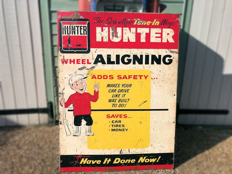 Original 1962 painted tin Hunter wheel aligning sign
