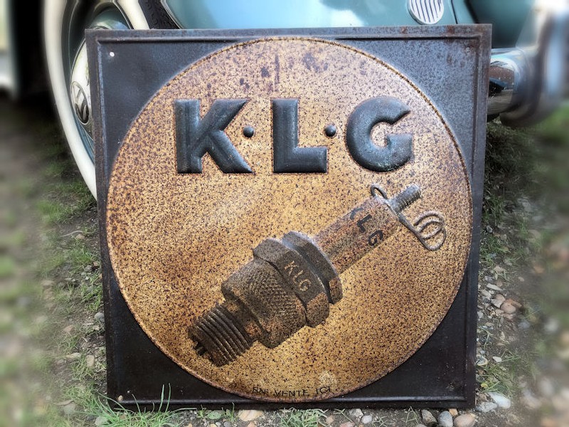 Embossed tin KLG spark plug sign