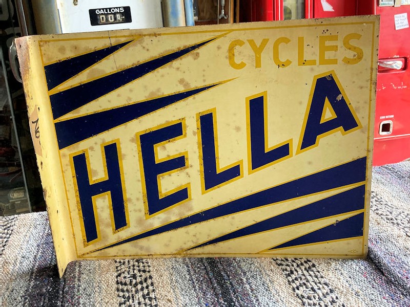 Hella cycles tin flange sign