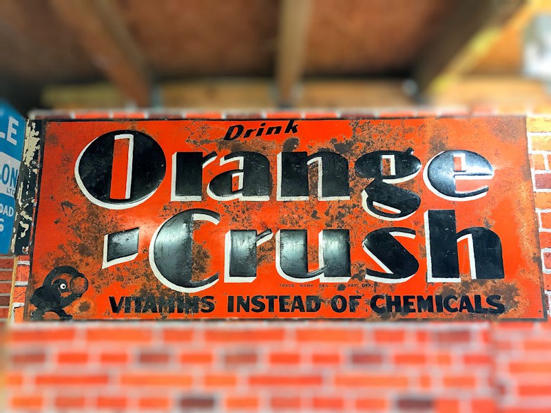 Rare early embossed tin Orange Crush sign