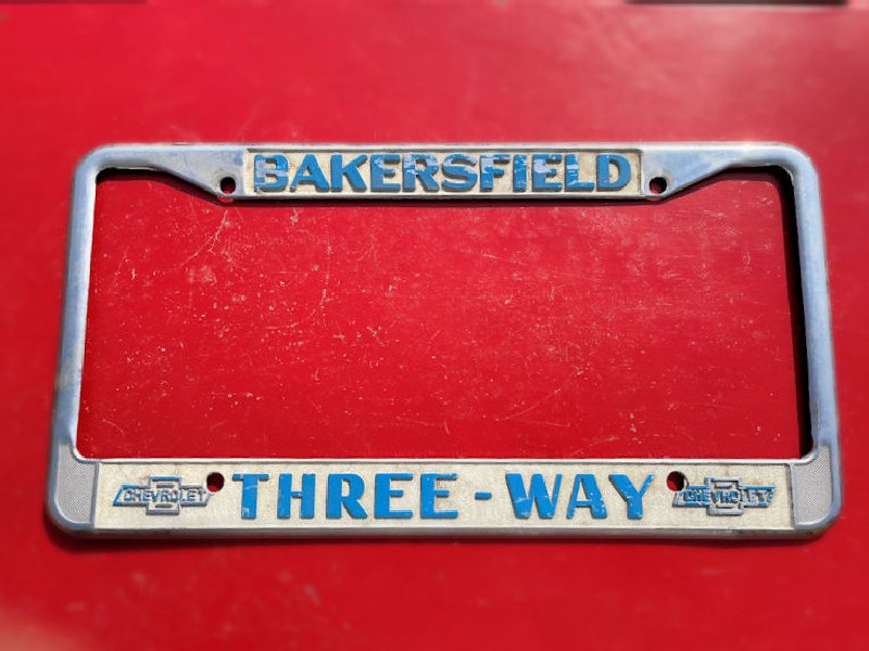 Original California Chevrolet dealership license plate surrounds