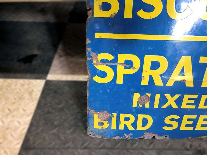 Original enamel Spratts dog and puppy biscuits and mixed bird seeds sign