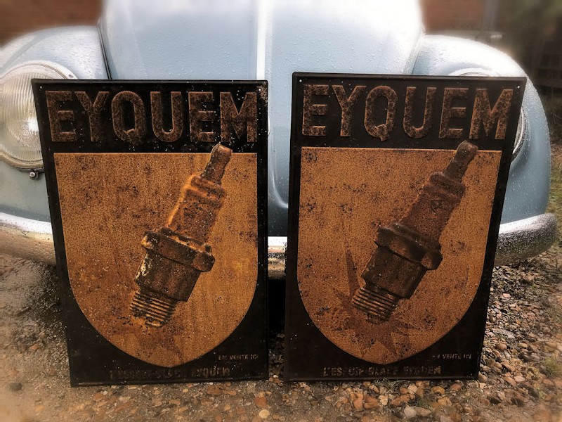 Embossed tin Eyquem spark plug sign