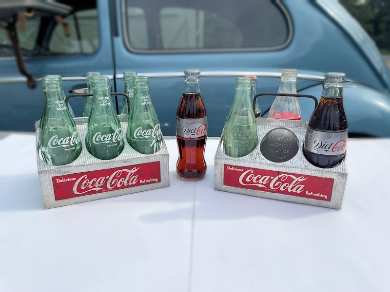 Original aluminium Coca Cola six pack carriers with empty bottles