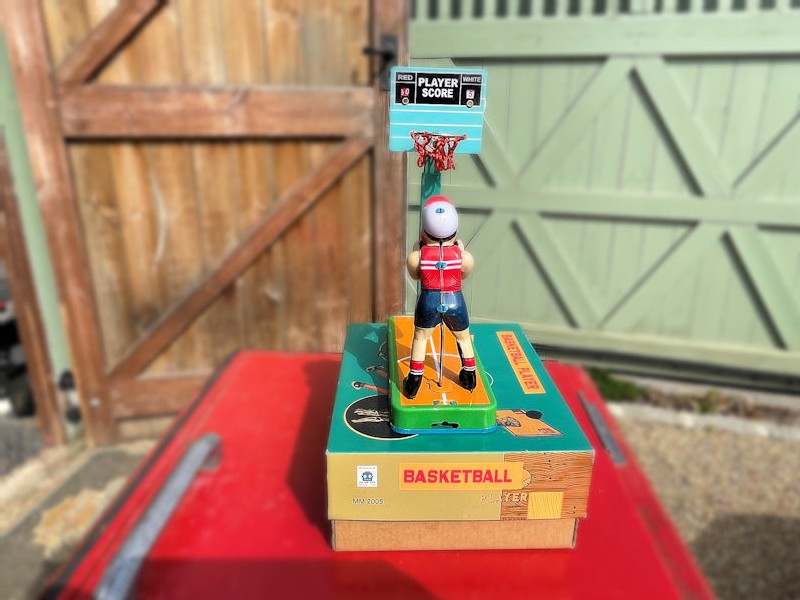 Vintage style basket ball player toy