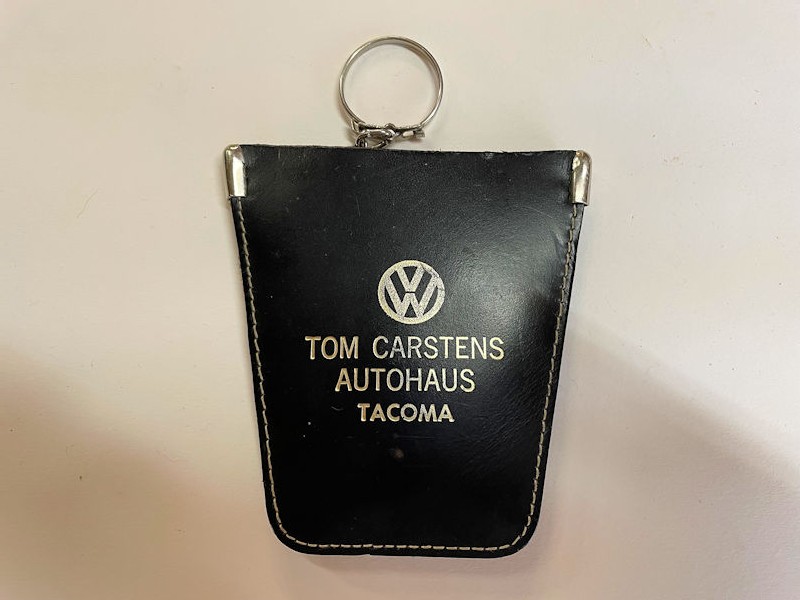 Vintage Tom Carstens Autohaus of Tacoma Volkswagen dealership license plate surround and key pouch