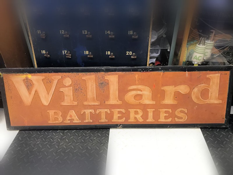 All original 1940s embossed tin Willard Batteries sign