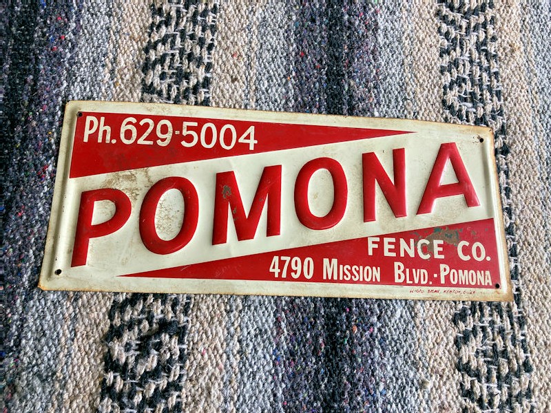 Embossed Pomona fencing co sign