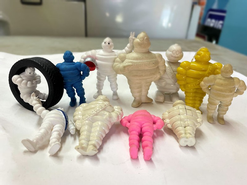 Selection of Bibendum Michelin man figurines and key rings