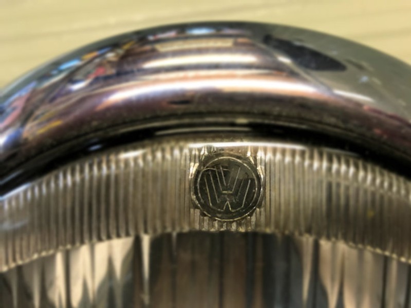 Original new old stock Oval Beetle VW logo Hella headlamps