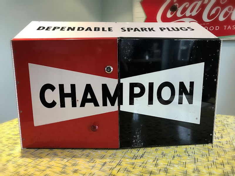 Original Champion spark plug storage cabinet
