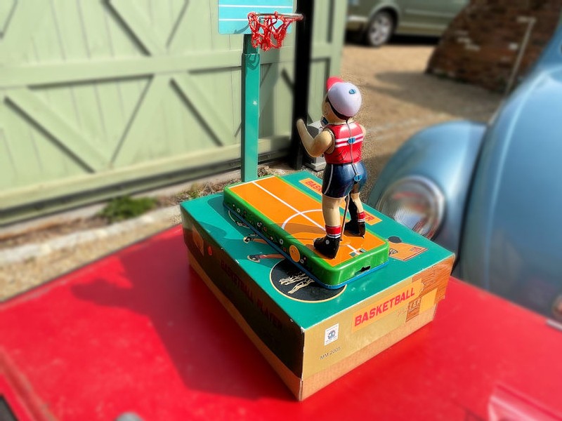 Vintage style basket ball player toy