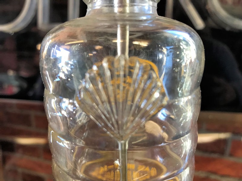 Early embossed glass Shell Kleanzit bottle