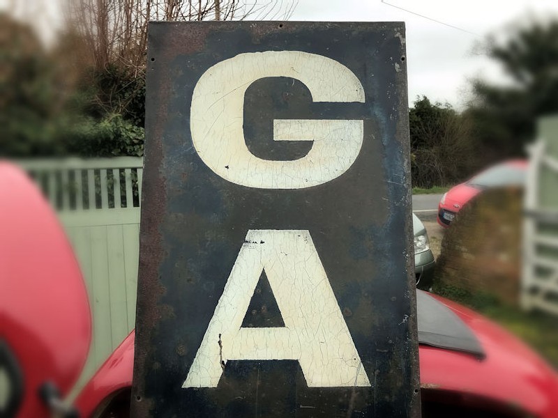 Original 1940s painted metal garage sign