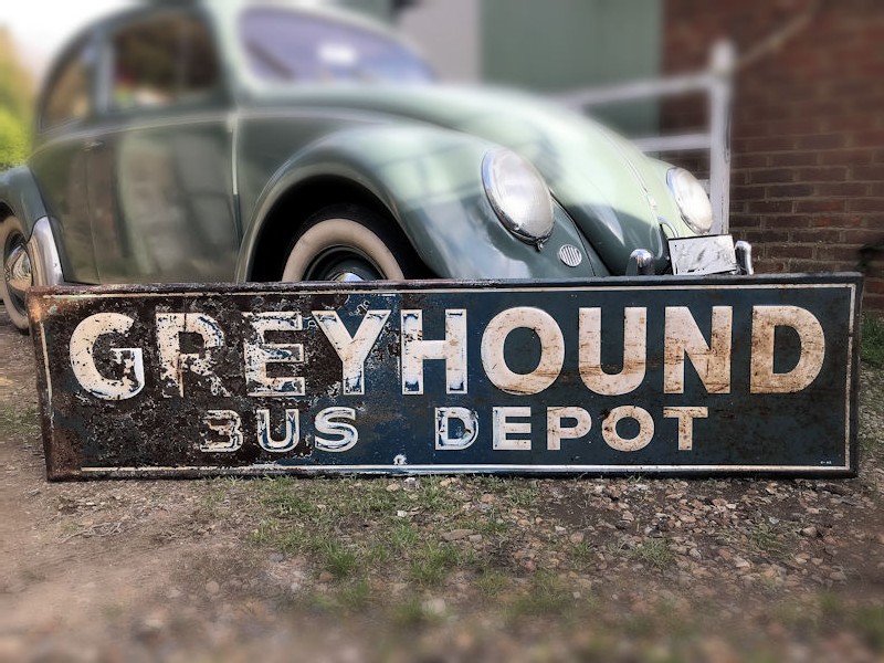 1968 embossed tin Greyhound bus depot sign