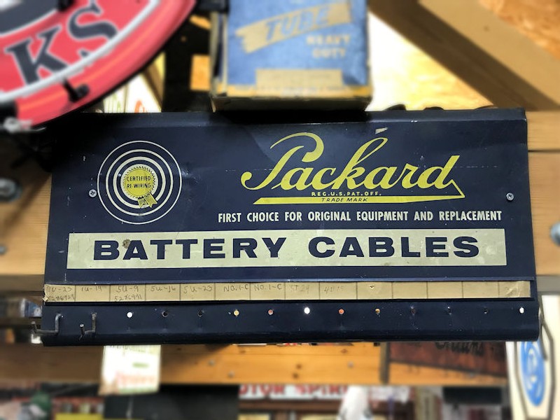 Original painted tin Packard battery cables rack