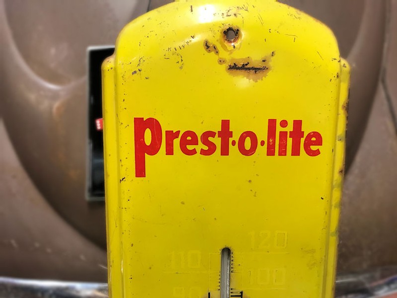 Original Prestolite tin thermometer sign