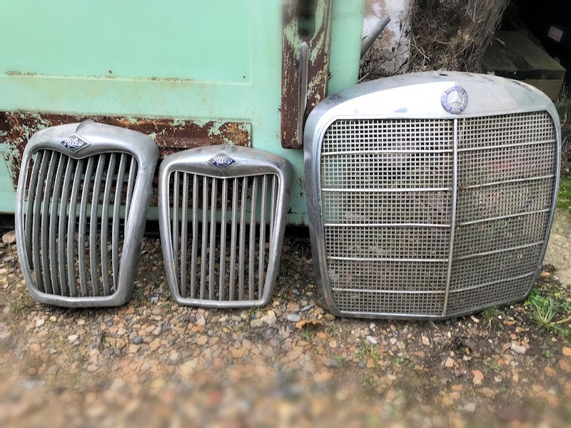 Selection of original vintage front grills and steering wheels