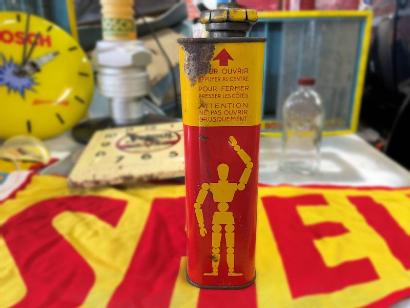 Vintage stick man robot Shell oil can