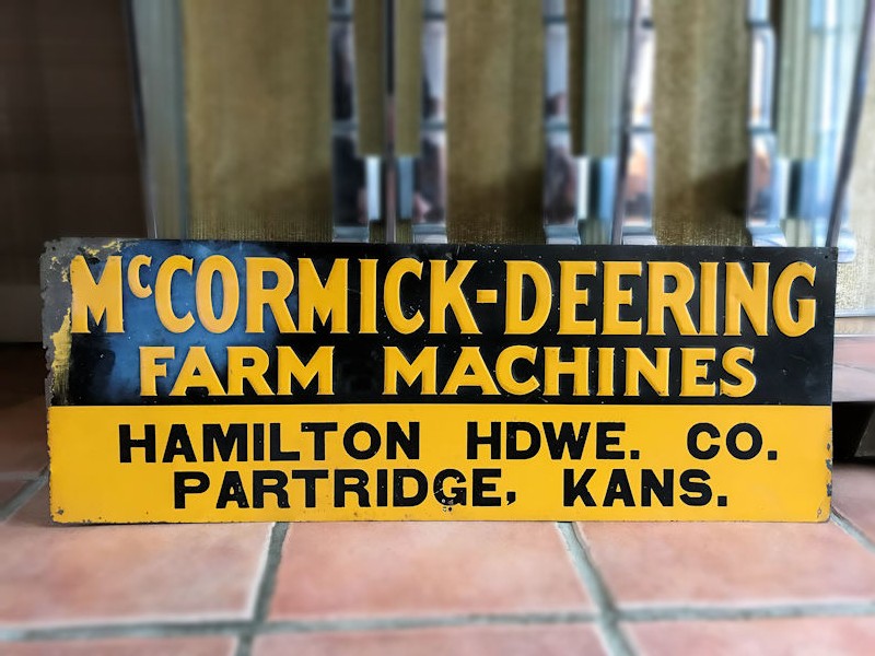 1940s embossed tin McCormick Deering tractor sign