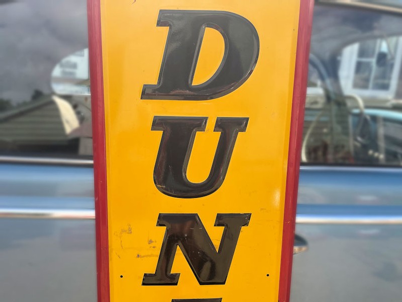 Original embossed tin Dunlop tire sign