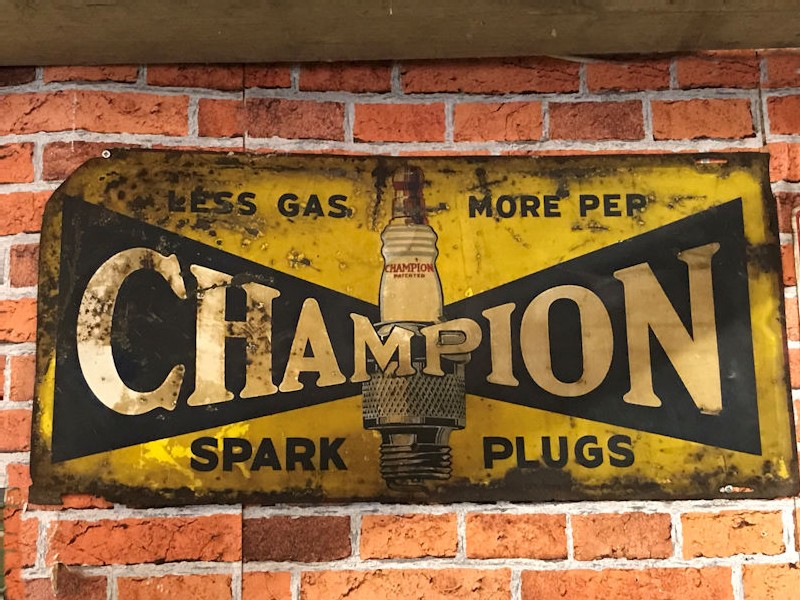 1930s painted tin Champion spark plug sign