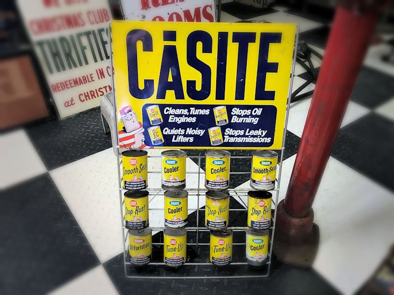 Original Casite oil rack and 12 cans
