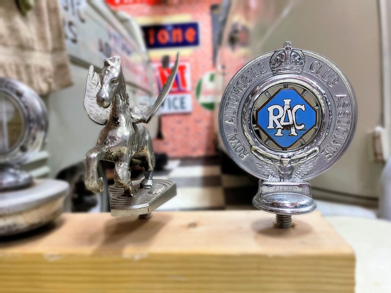 Selection of vintage hood ornaments including Rolls Royce and Ford Model A